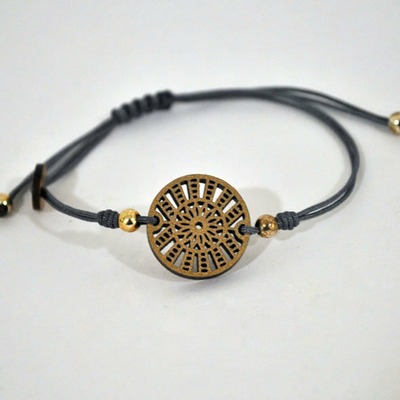 Pulsera de cuero con pieza de madera círculos | DORADO